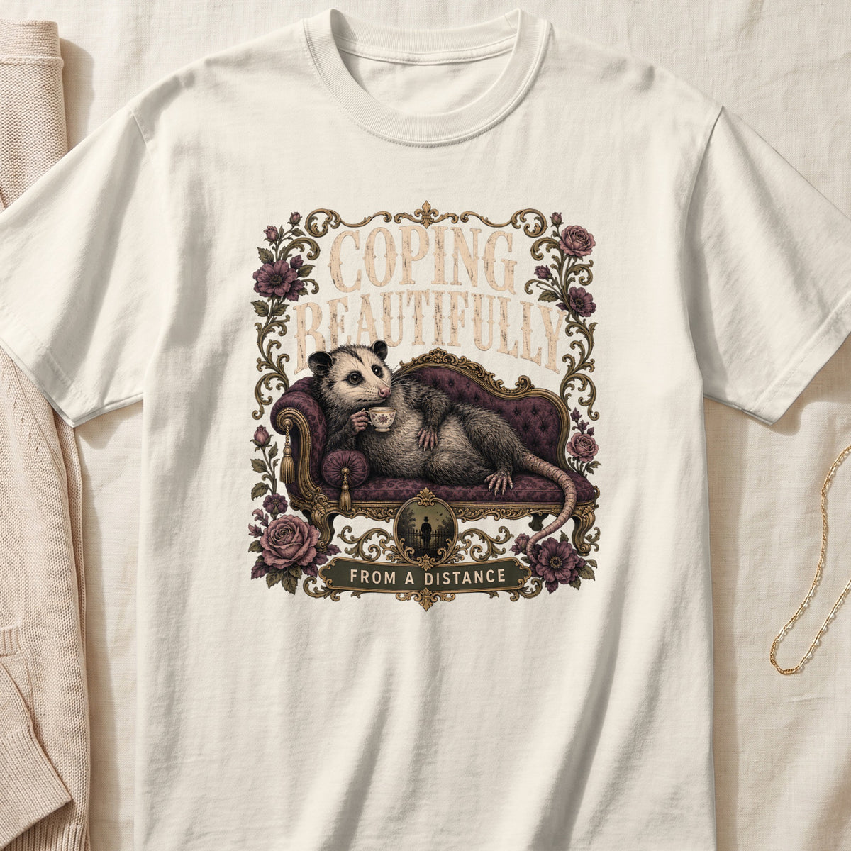 Opossum lounging on a couch, drinking tea, with text "COPING BEAUTIFULLY FROM A DISTANCE".
