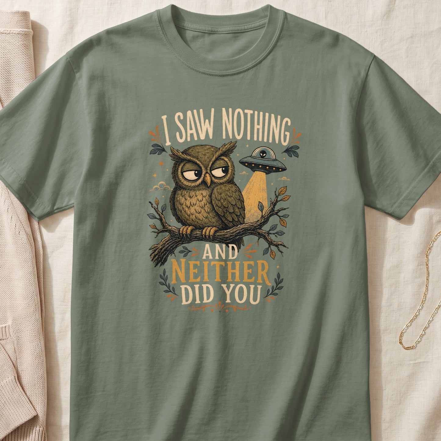 Green t-shirt with owl, UFO, and text "I SAW NOTHING AND NEITHER DID YOU."