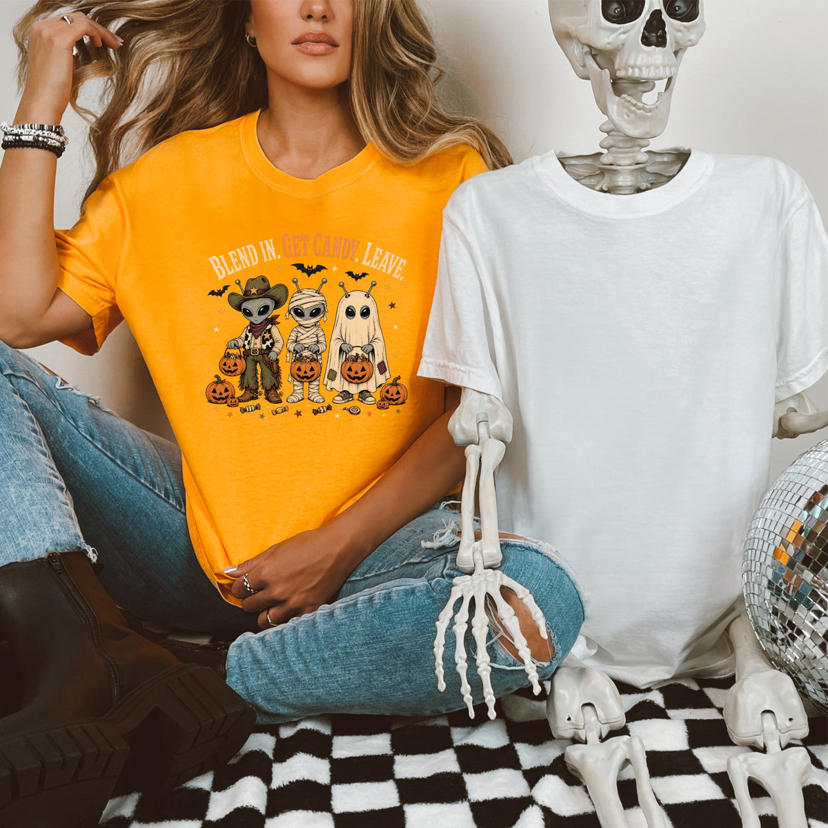 Orange t-shirt with Halloween graphic and text "BLEND IN. GET CANDY. LEAVE."