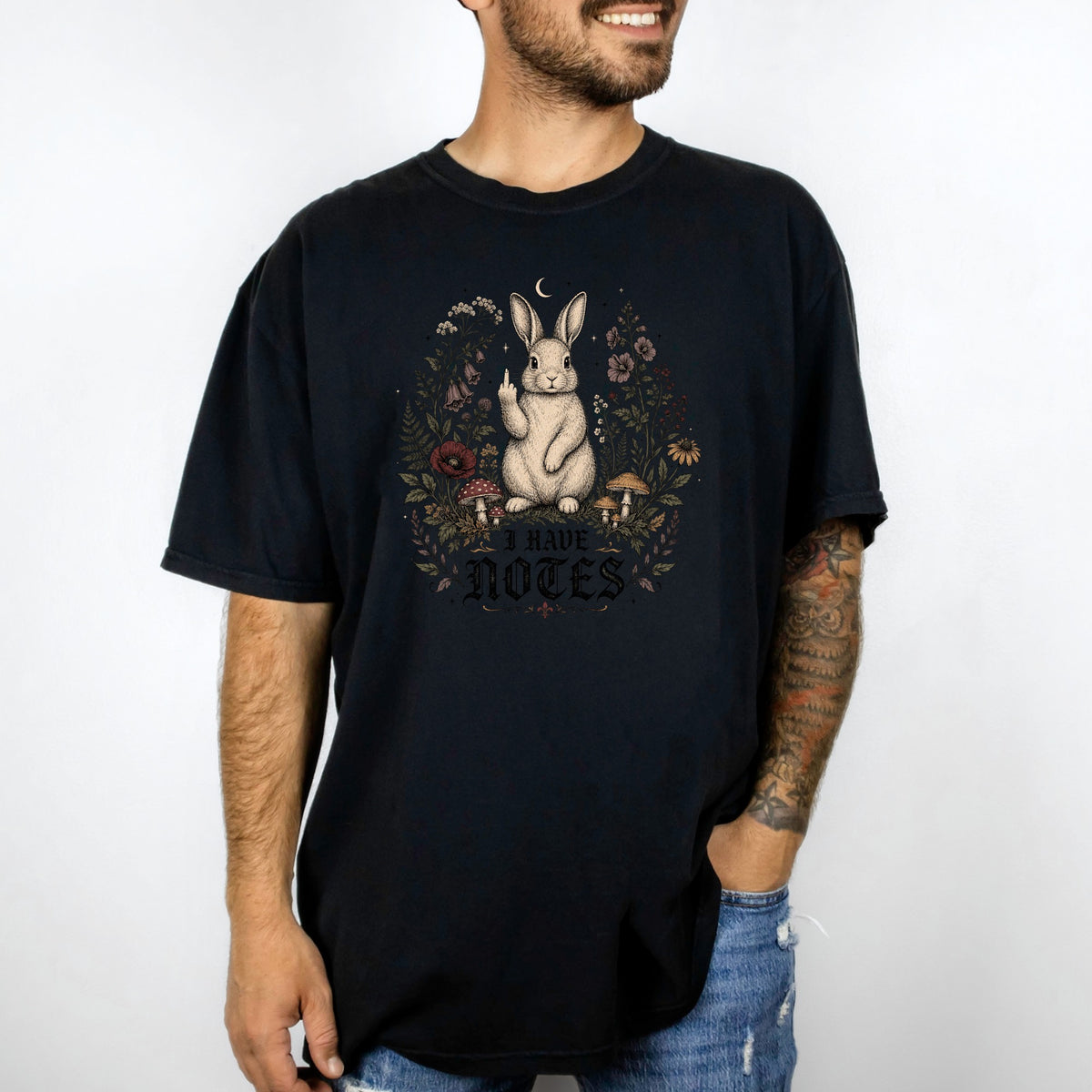 Black t-shirt with a rabbit surrounded by flowers and text "I HAVE NOTES".