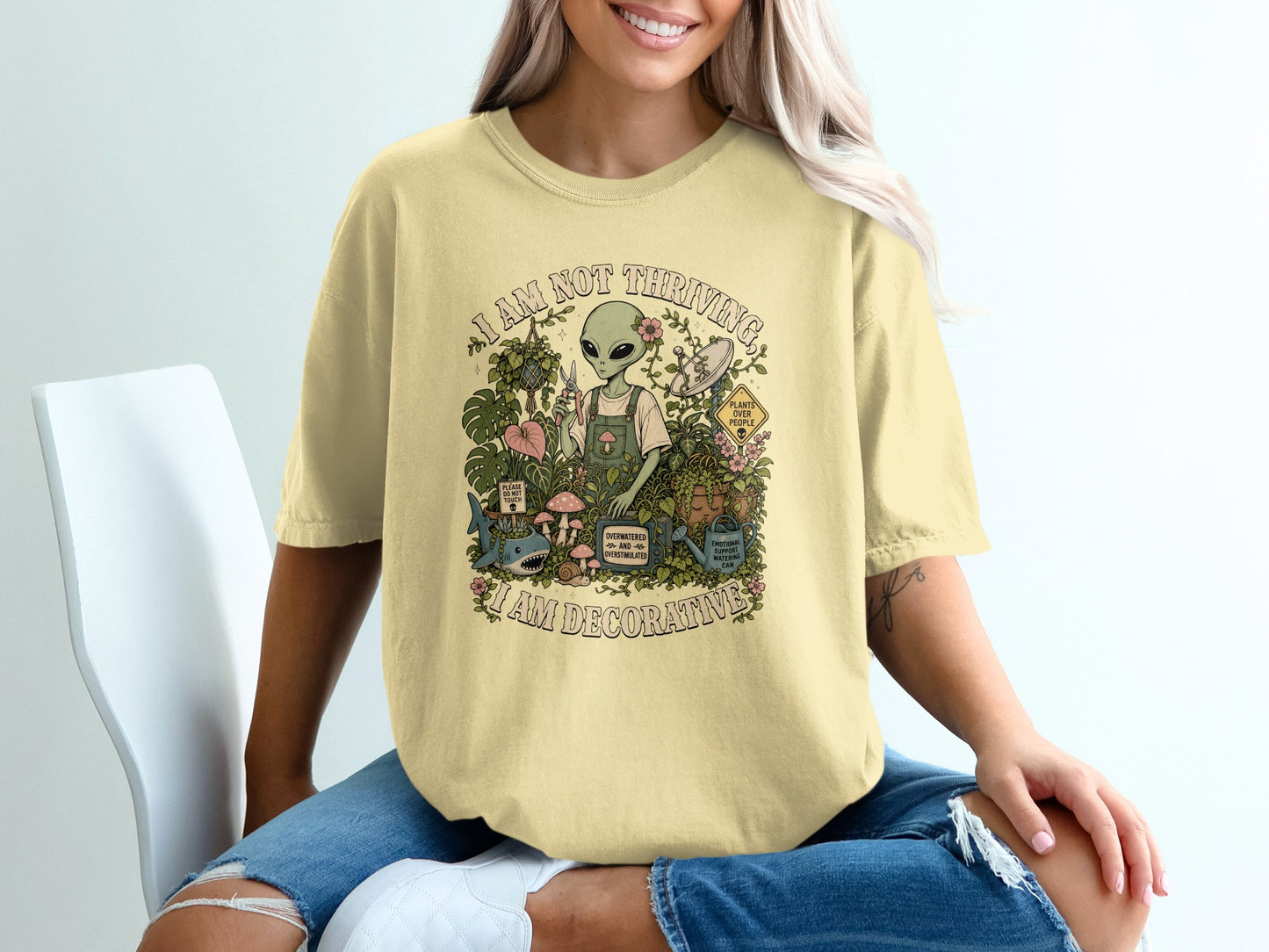 Alien tending plants with text "I AM NOT THRIVING, I AM DECORATIVE."