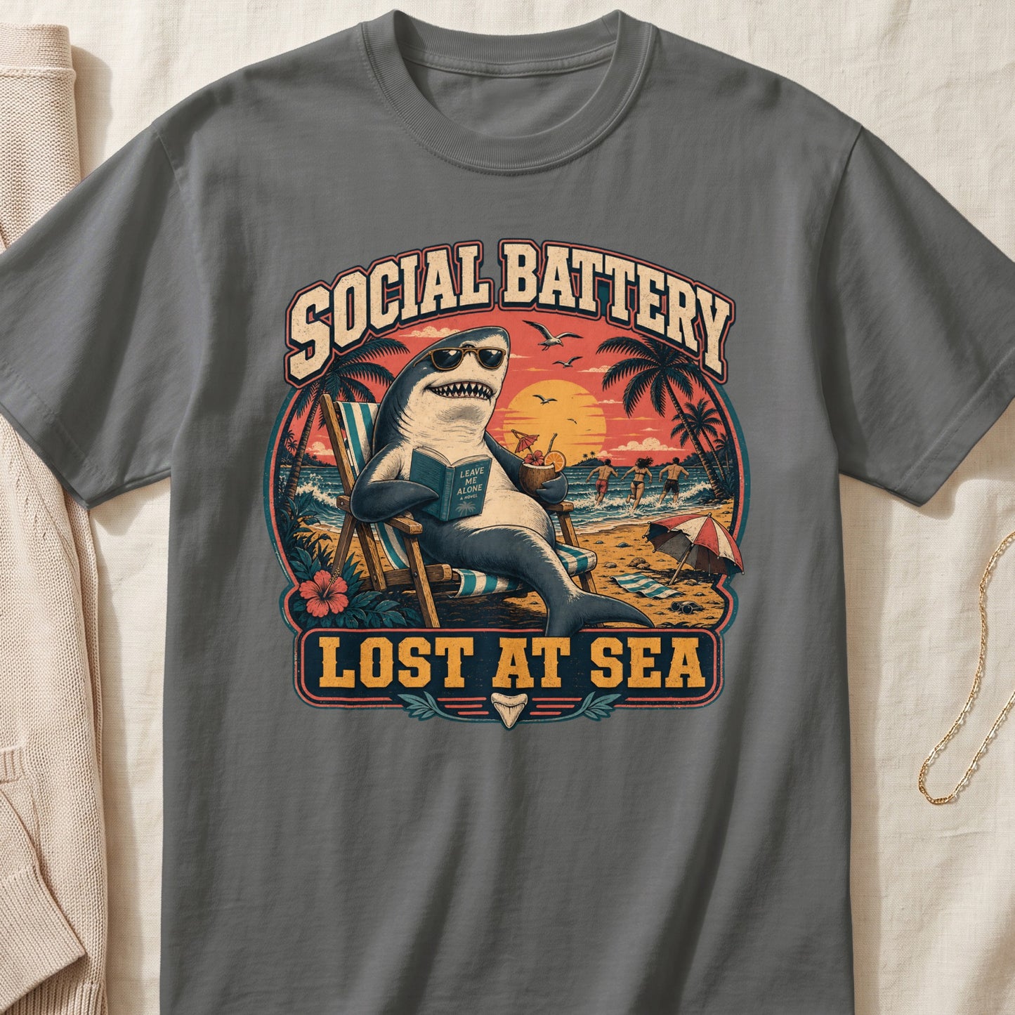 Shark wearing sunglasses reads "Leave Me Alone" on a beach with text "Social Battery Lost At Sea".