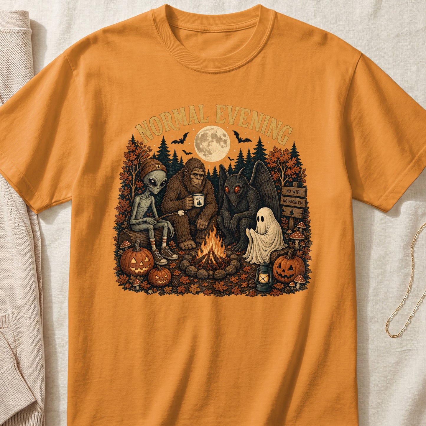 Alien, Bigfoot, Mothman, and ghost around campfire under "Normal Evening" text.