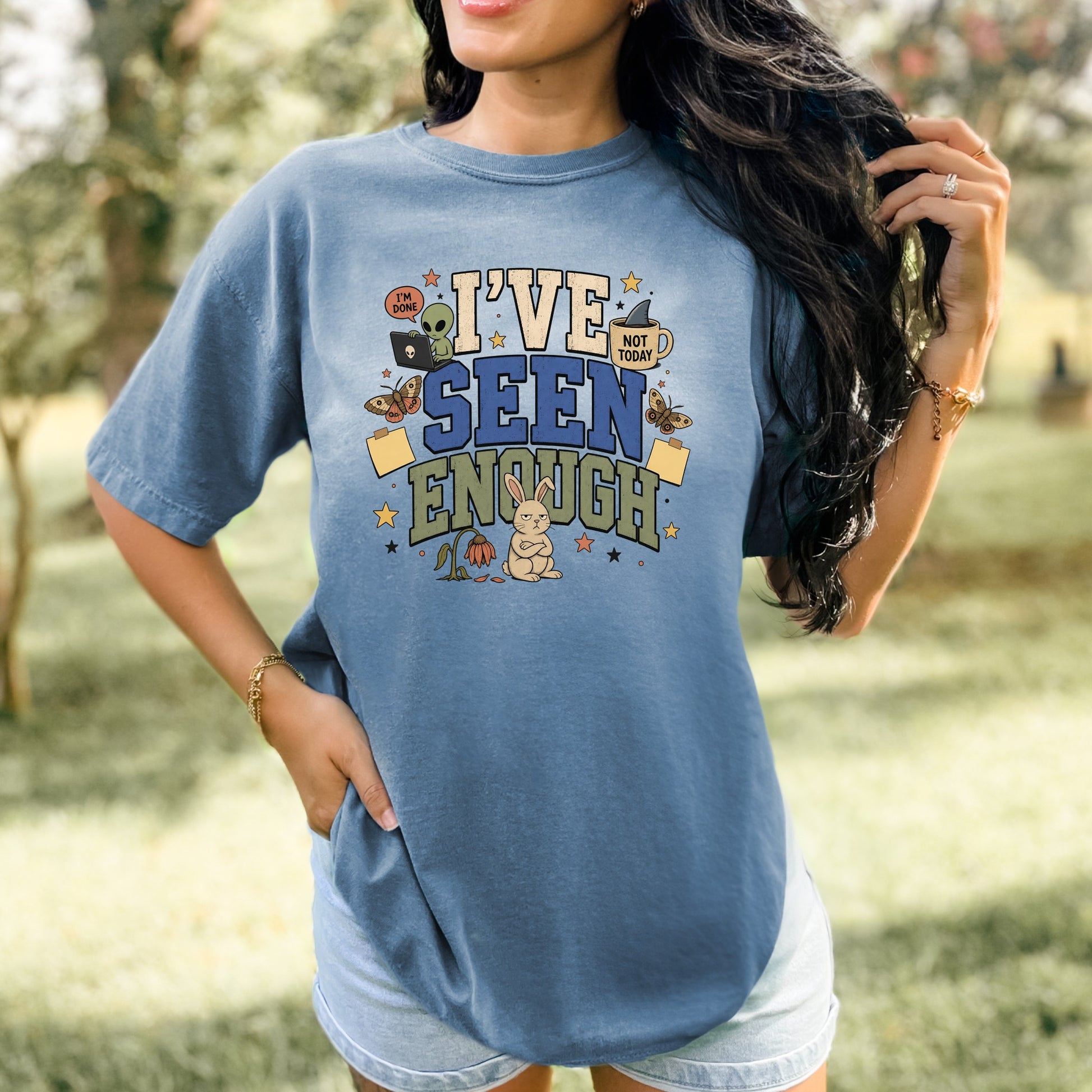 Blue t-shirt with "I've Seen Enough" text, alien, bunny, and butterflies design.