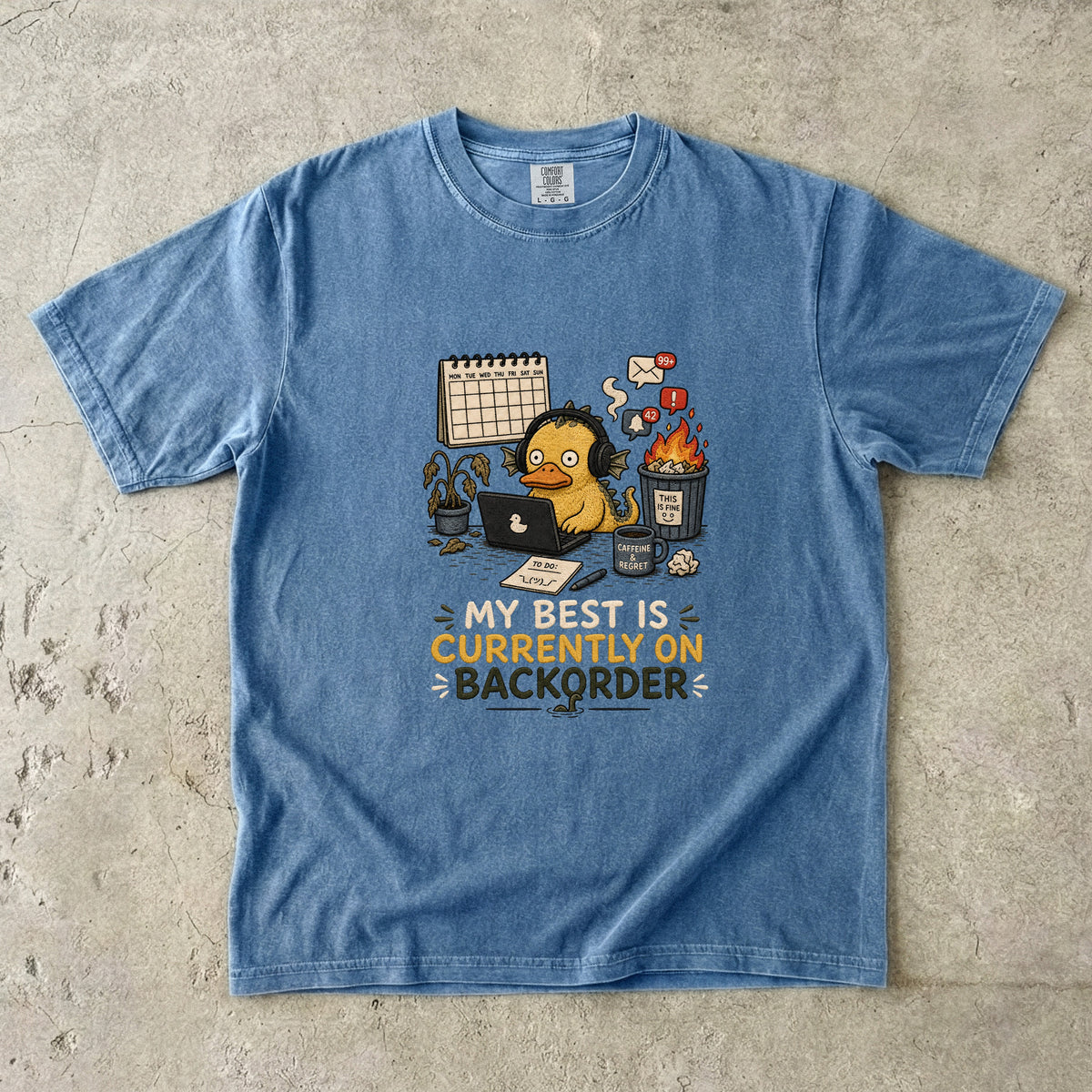 T-shirt with cartoon duck wearing headphones at a computer, text reads "My best is currently on backorder".
