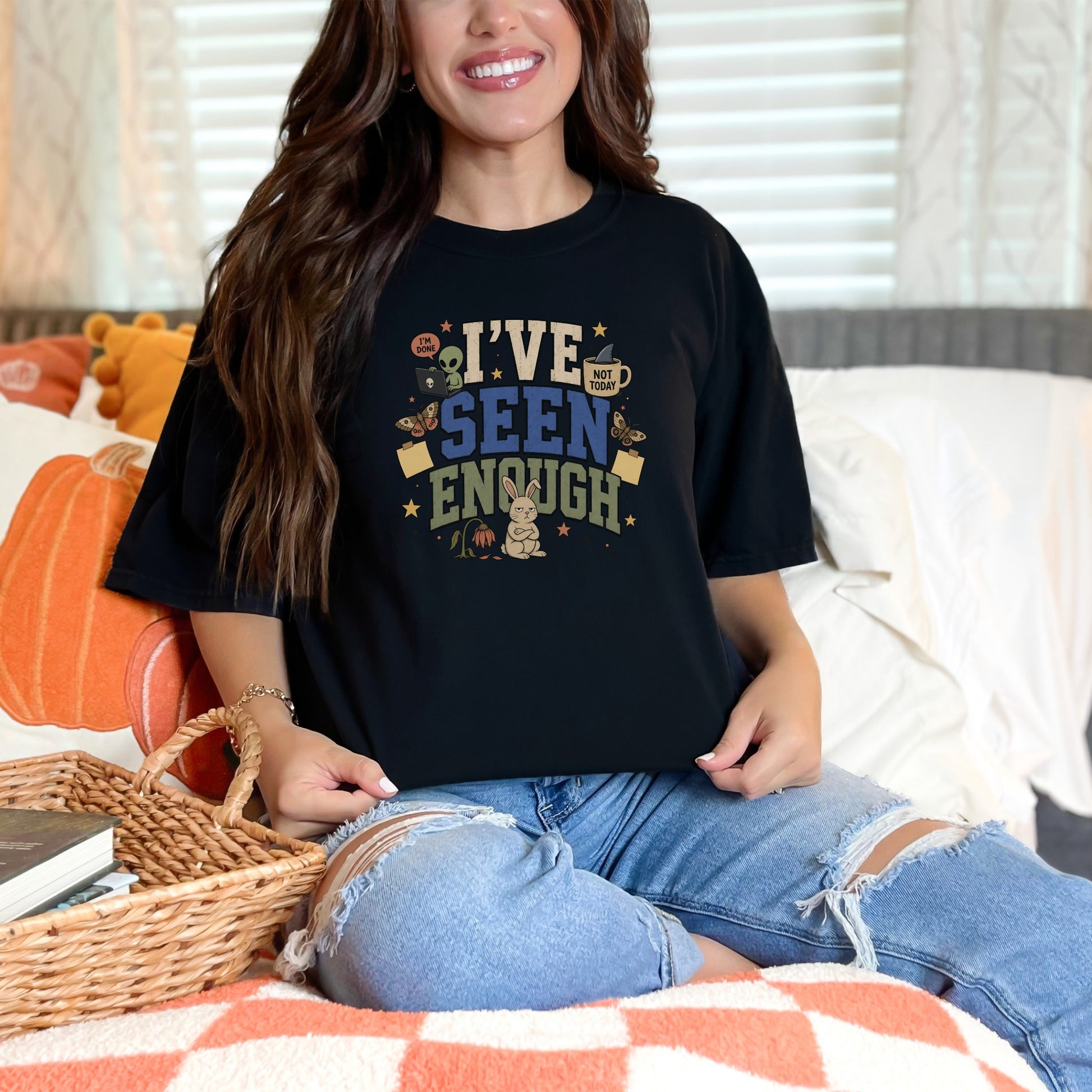 Black t-shirt with "I've seen enough" and illustrations of an alien, bunny, and mug.