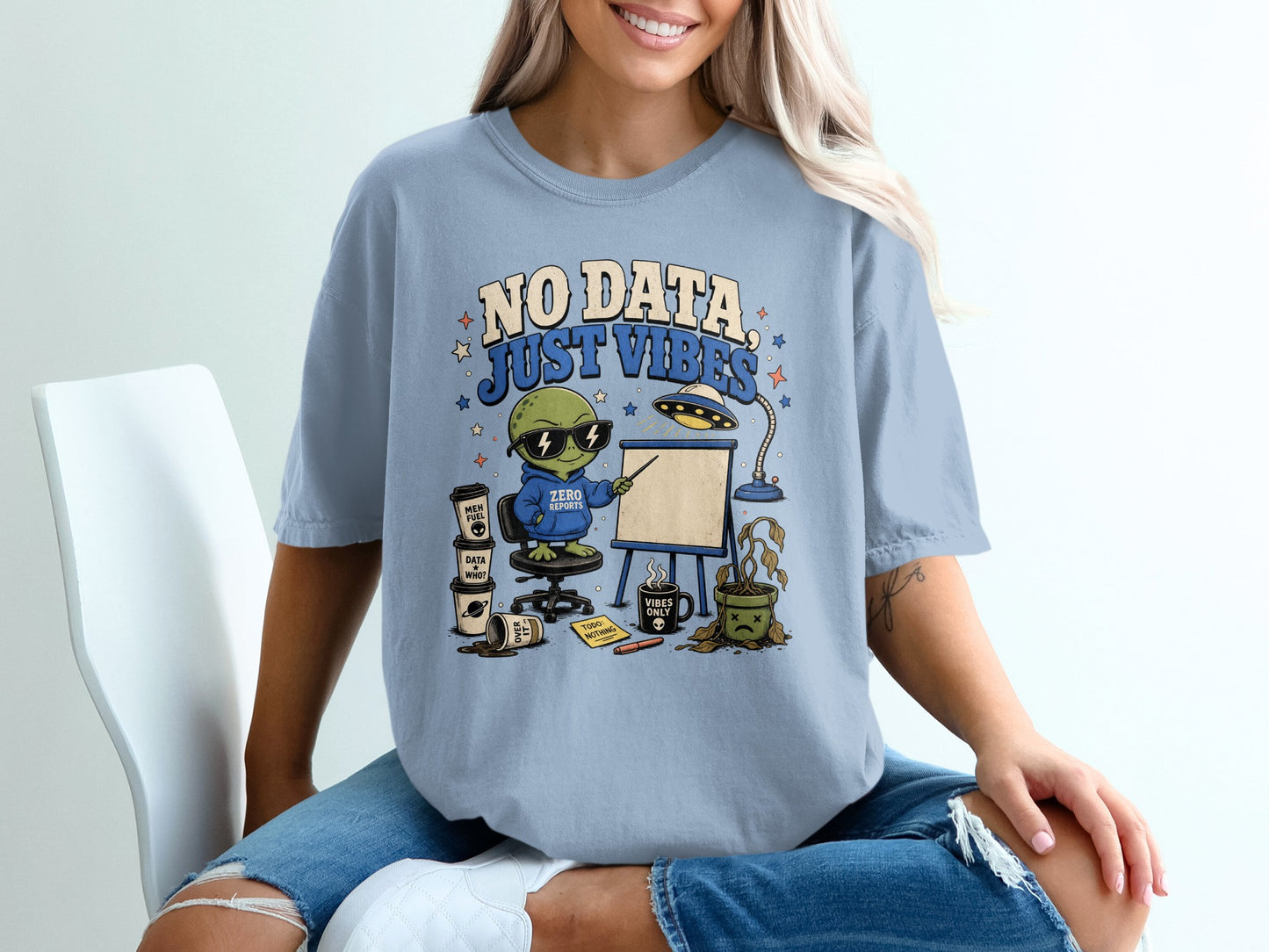 Alien wearing "Zero Reports" hoodie presenting "No Data, Just Vibes" with coffee and dead plant.