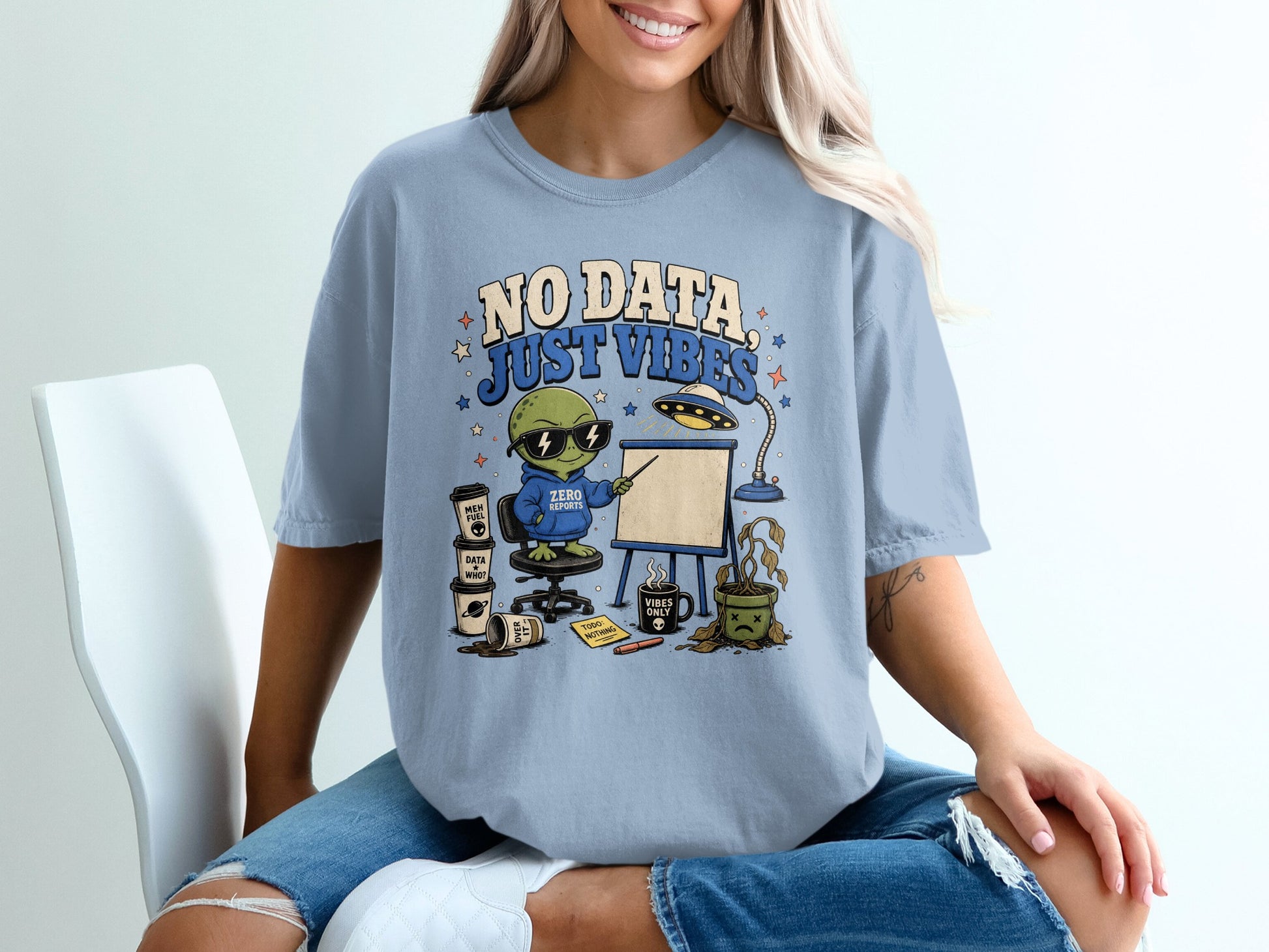 Alien wearing "Zero Reports" hoodie presenting "No Data, Just Vibes" with coffee and dead plant.