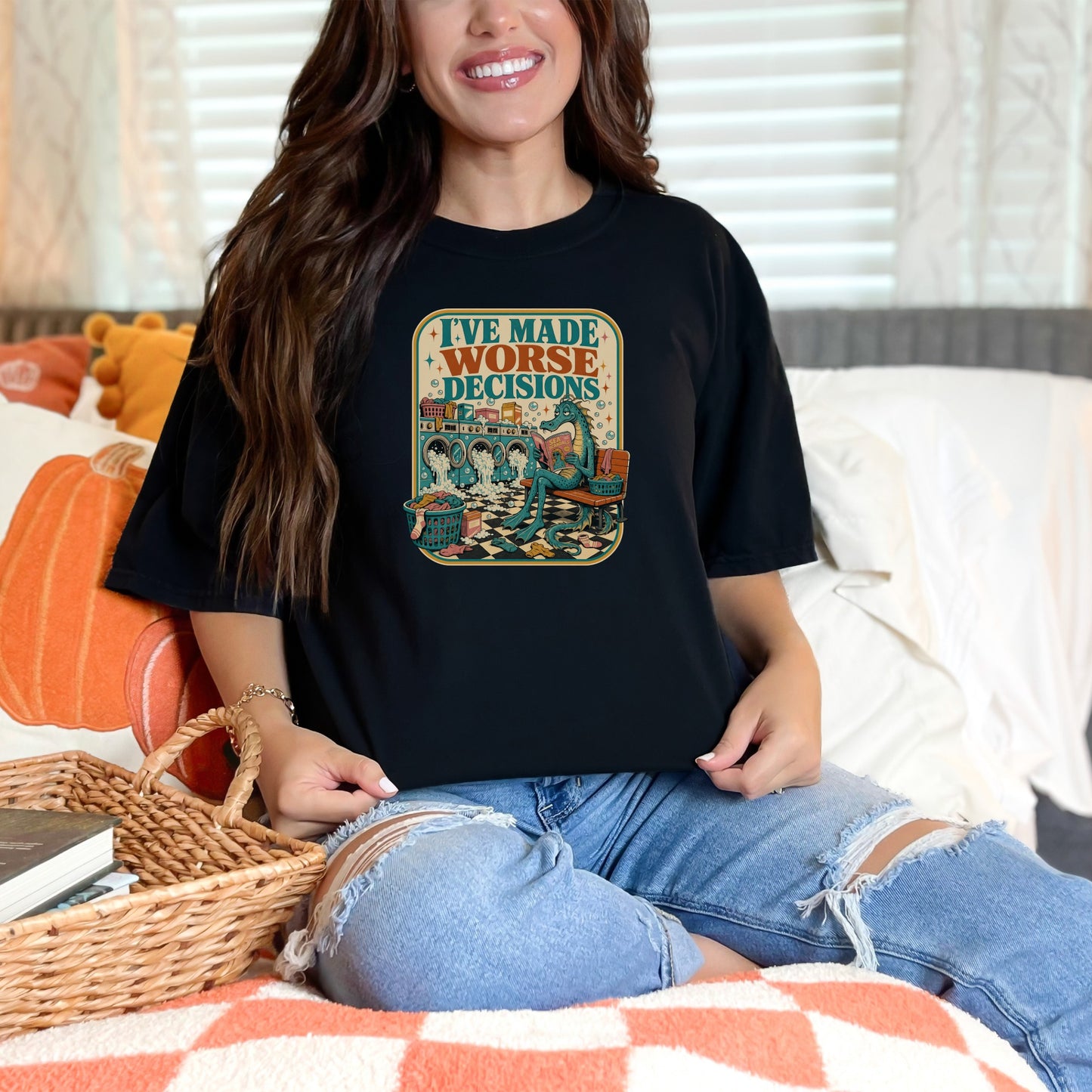 Black t-shirt with "I've Made Worse Decisions" text and dragon doing laundry graphic.