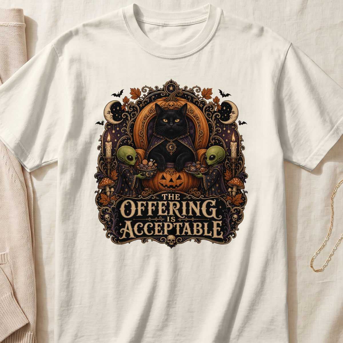 Black cat with aliens and pumpkin, text "The Offering Is Acceptable".