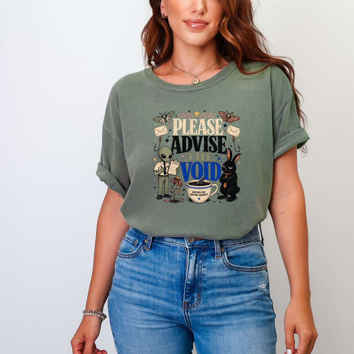 T-shirt with graphic of alien, rabbit, and text "Please Advise The Void"