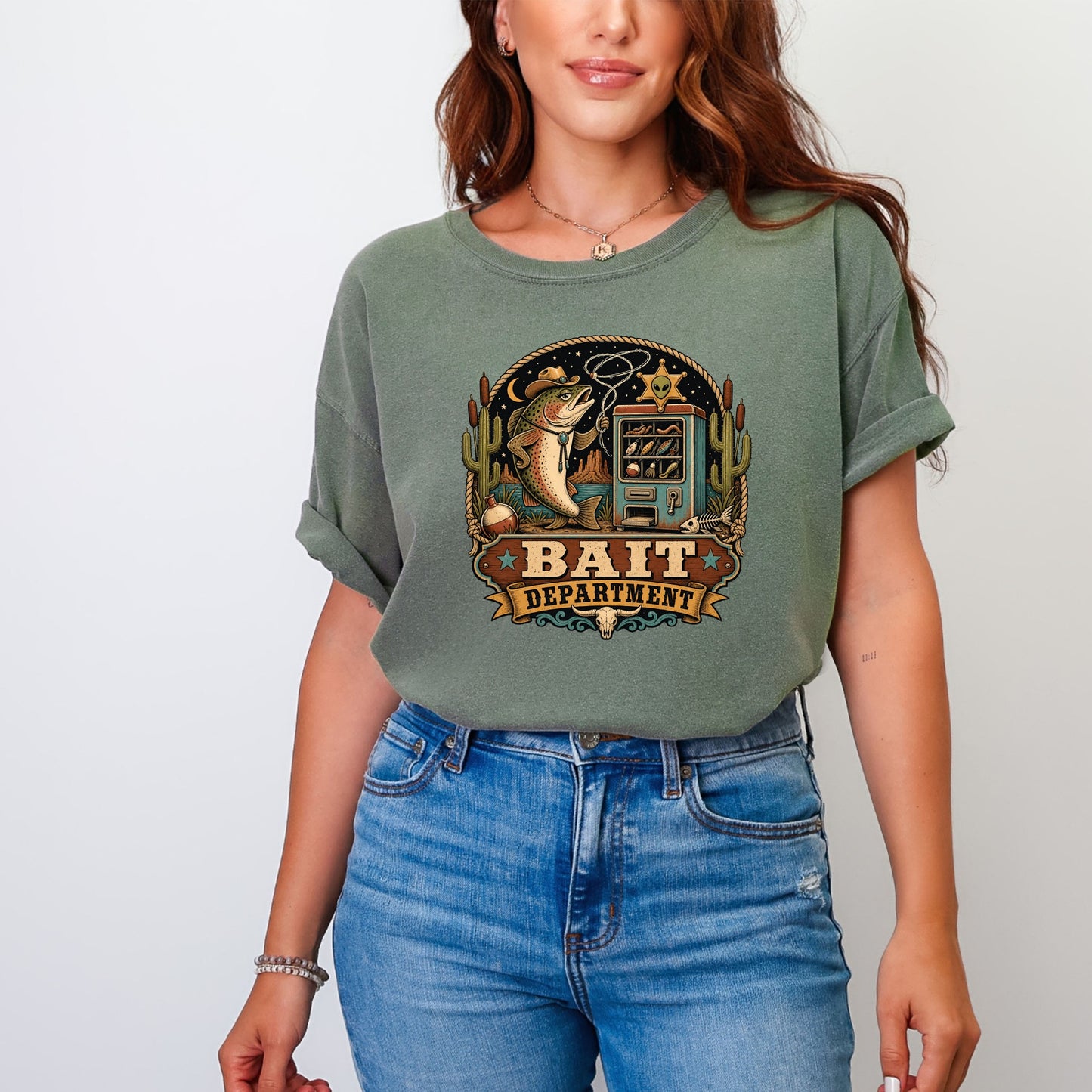 Green t-shirt featuring a graphic with a fish, a bait machine, and text that reads "Bait Department."