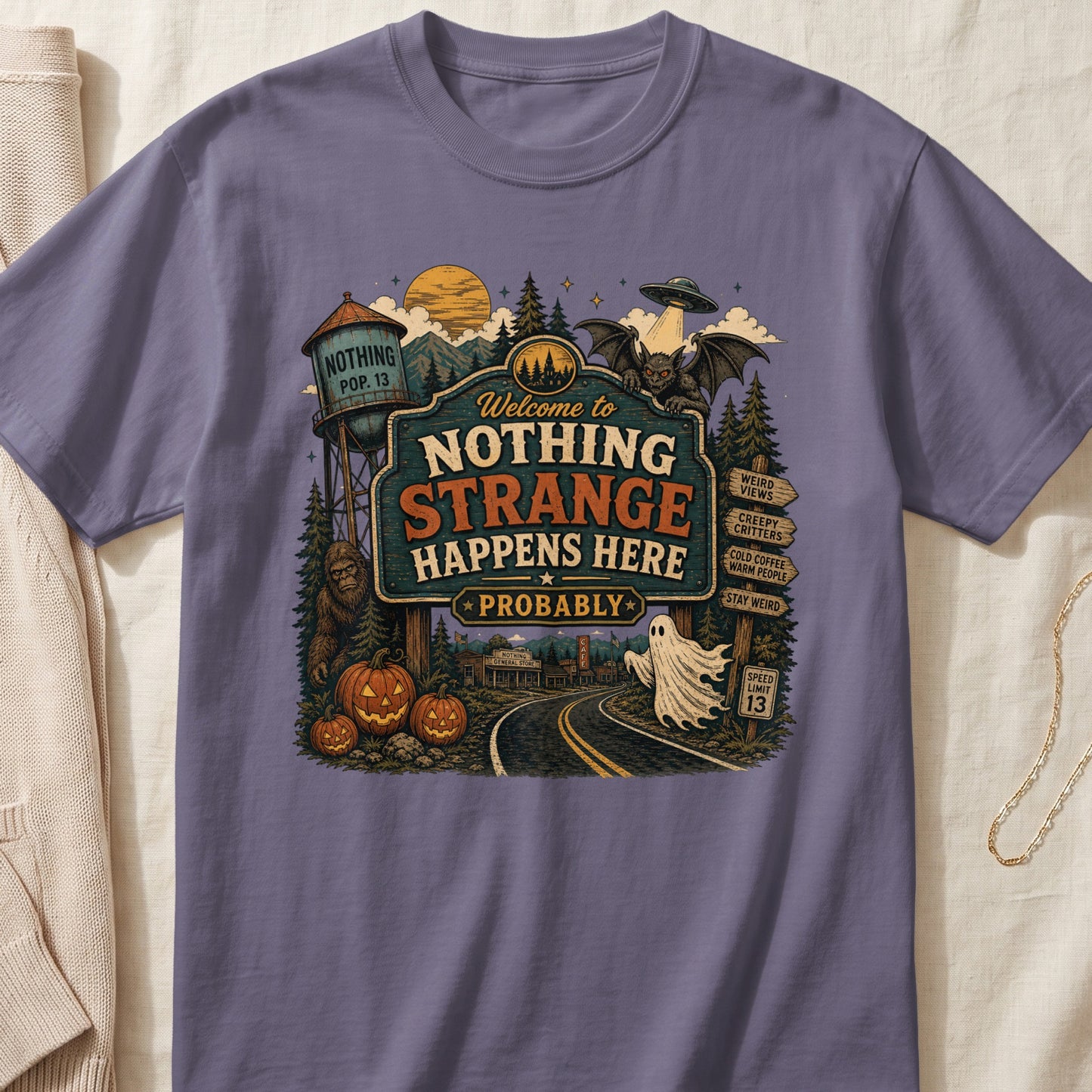 Welcome to Nothing Strange Happens Here Probably sign with Bigfoot, ghost, and UFO.