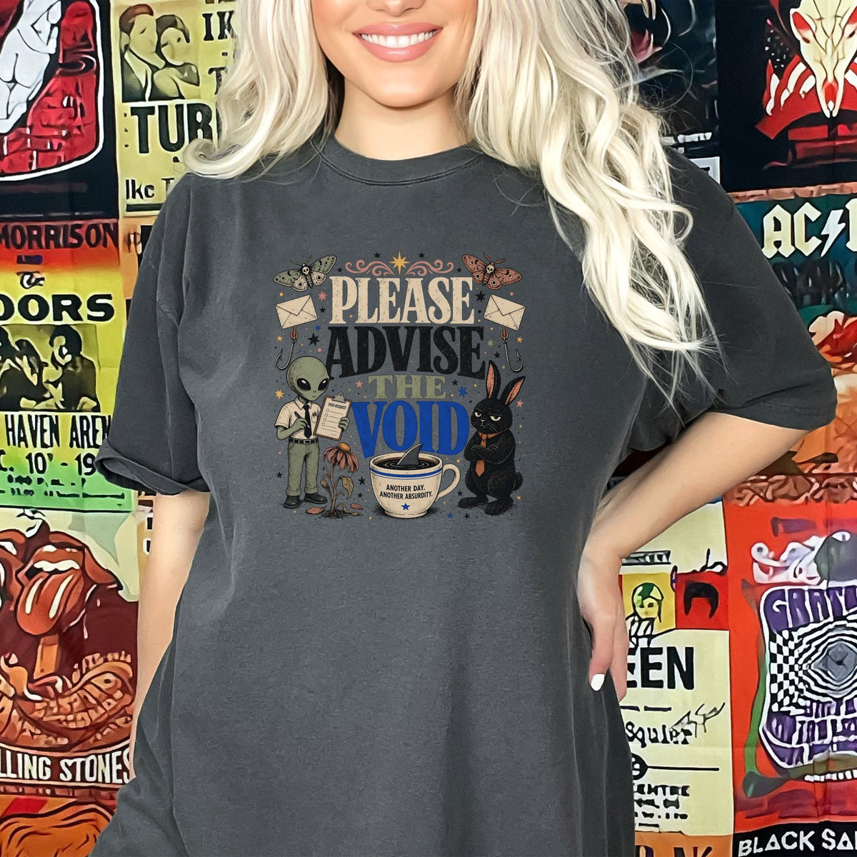 Graphic tee with alien, rabbit, coffee cup, and text "PLEASE ADVISE THE VOID".