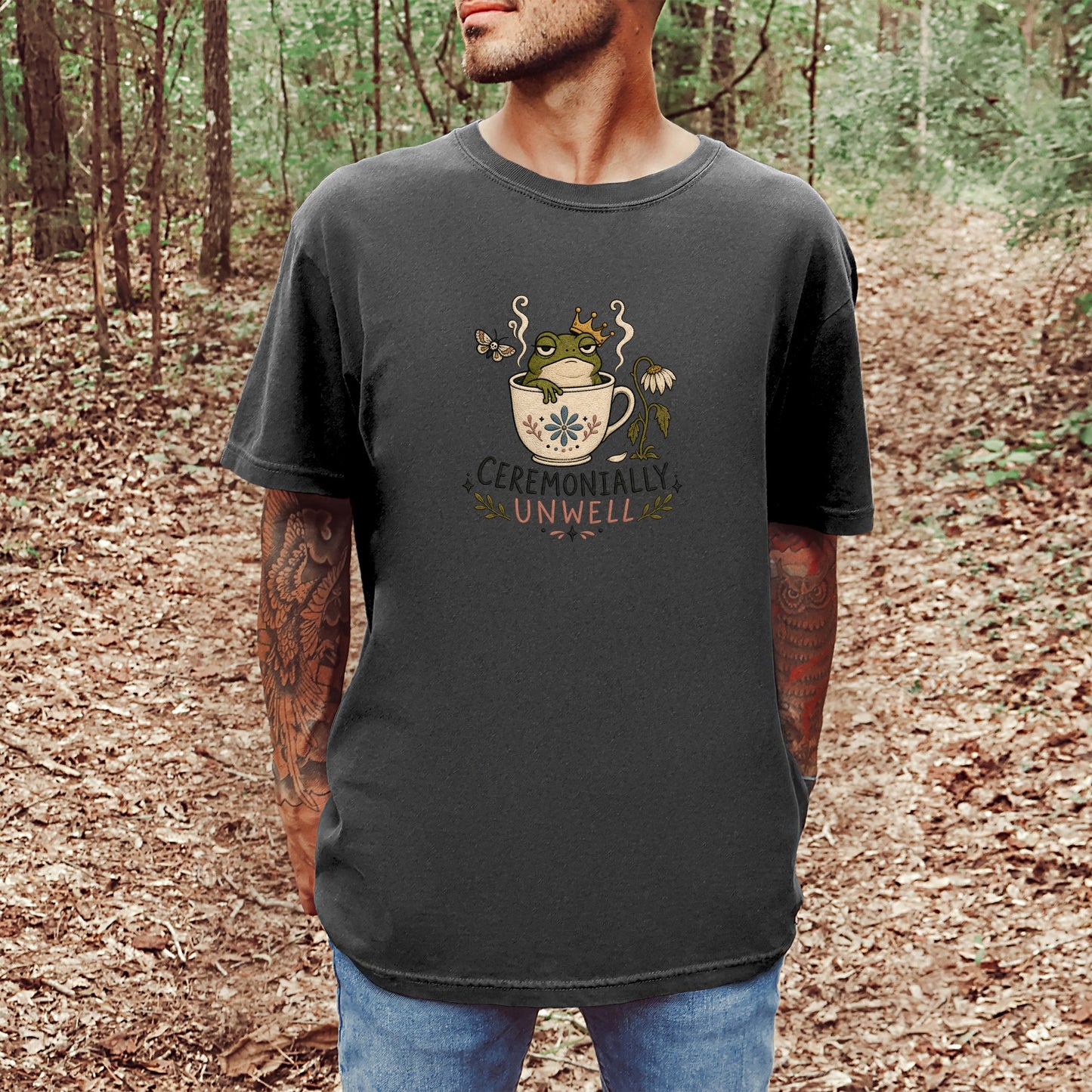 T-shirt graphic of frog in crown in teacup with text "CEREMONALLY UNWELL"