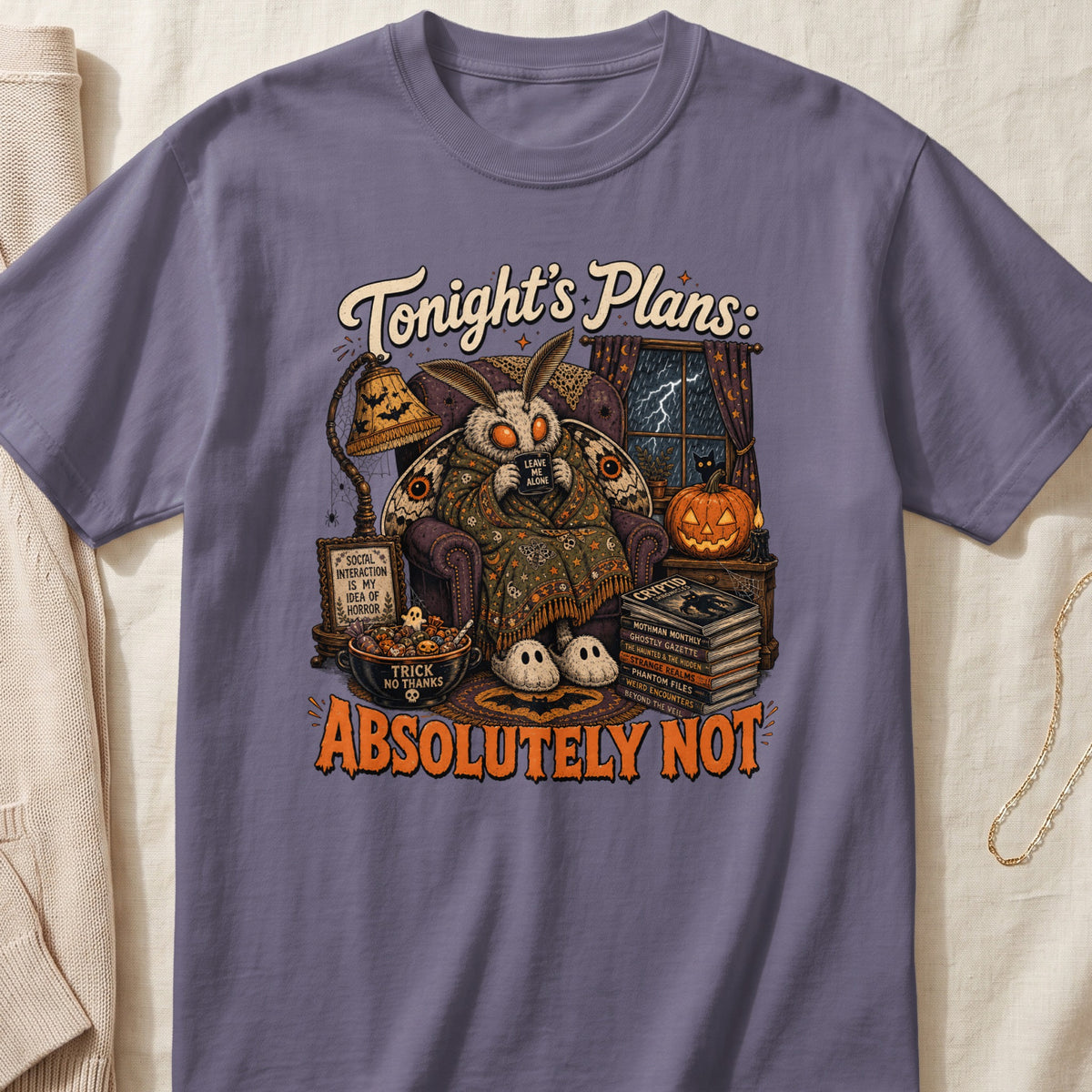Moth in chair with "Tonight's Plans: Absolutely Not" text and Halloween decor.