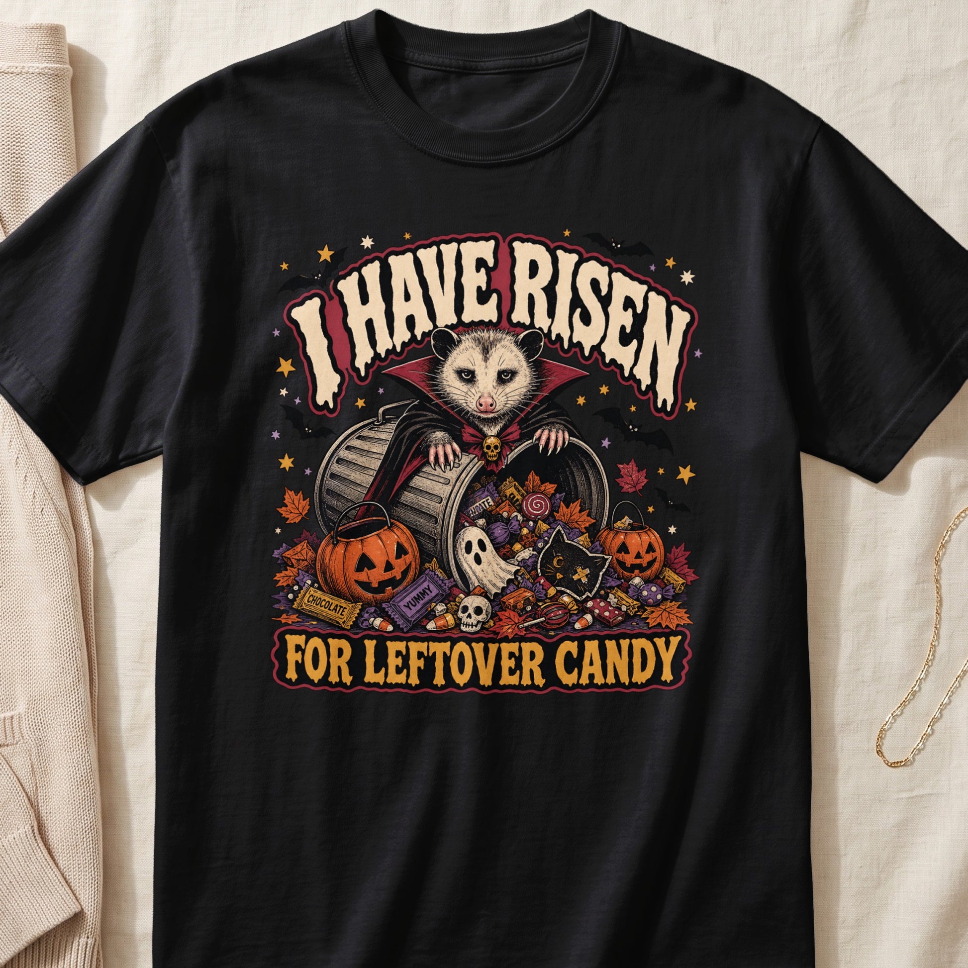 Black t-shirt with "I HAVE RISEN FOR LEFTOVER CANDY" and Halloween graphics.