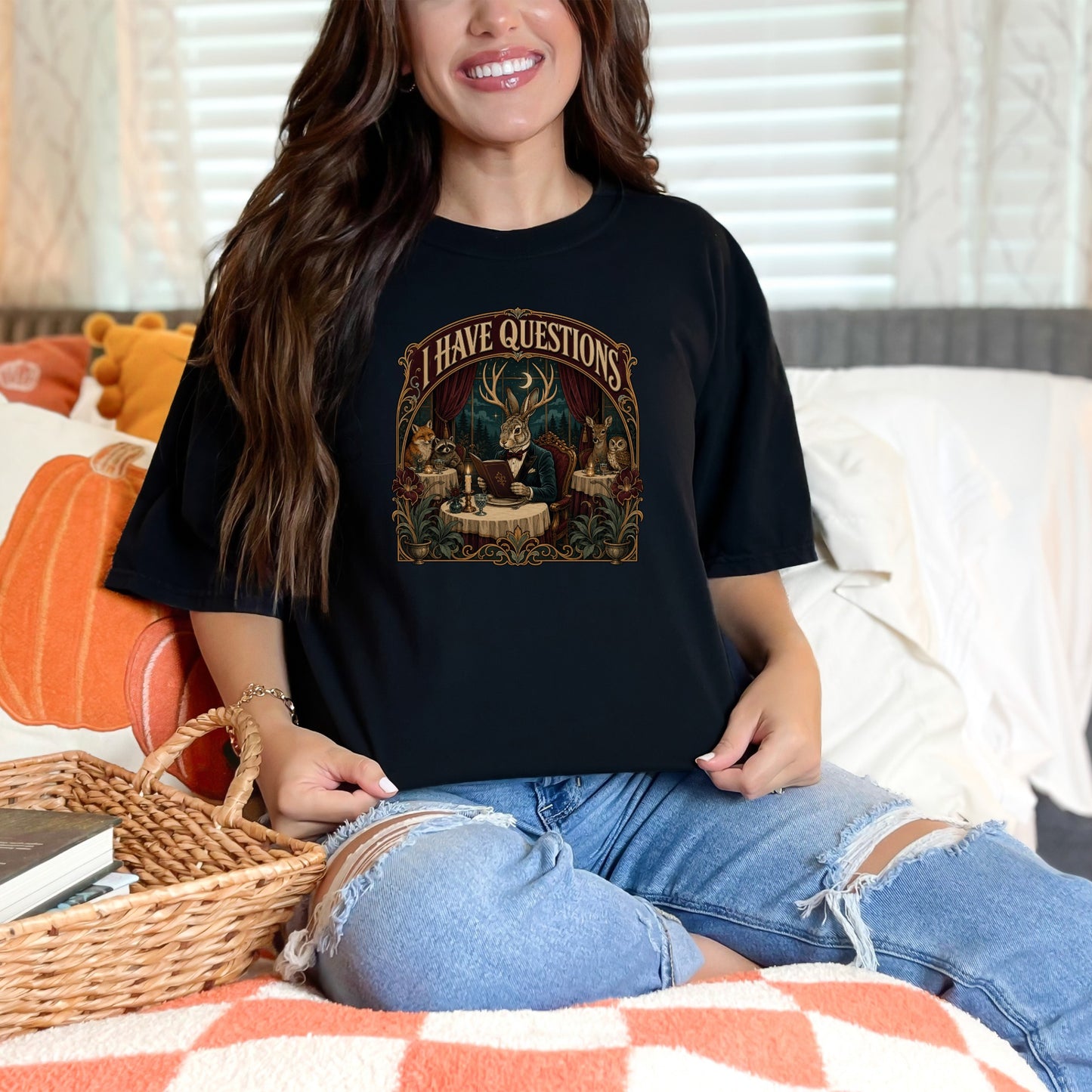 Black t-shirt with "I HAVE QUESTIONS" and animals at a table graphic.