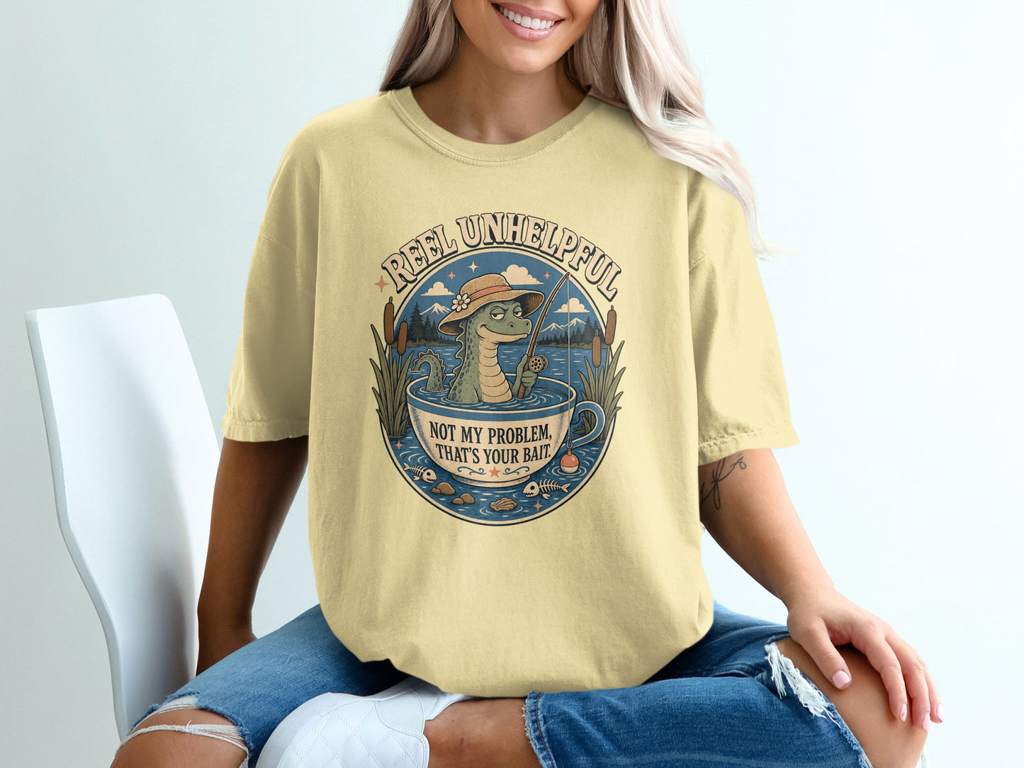 Alligator in a teacup fishing with text "Reel Unhelpful" and "Not My Problem, That's Your Bait."