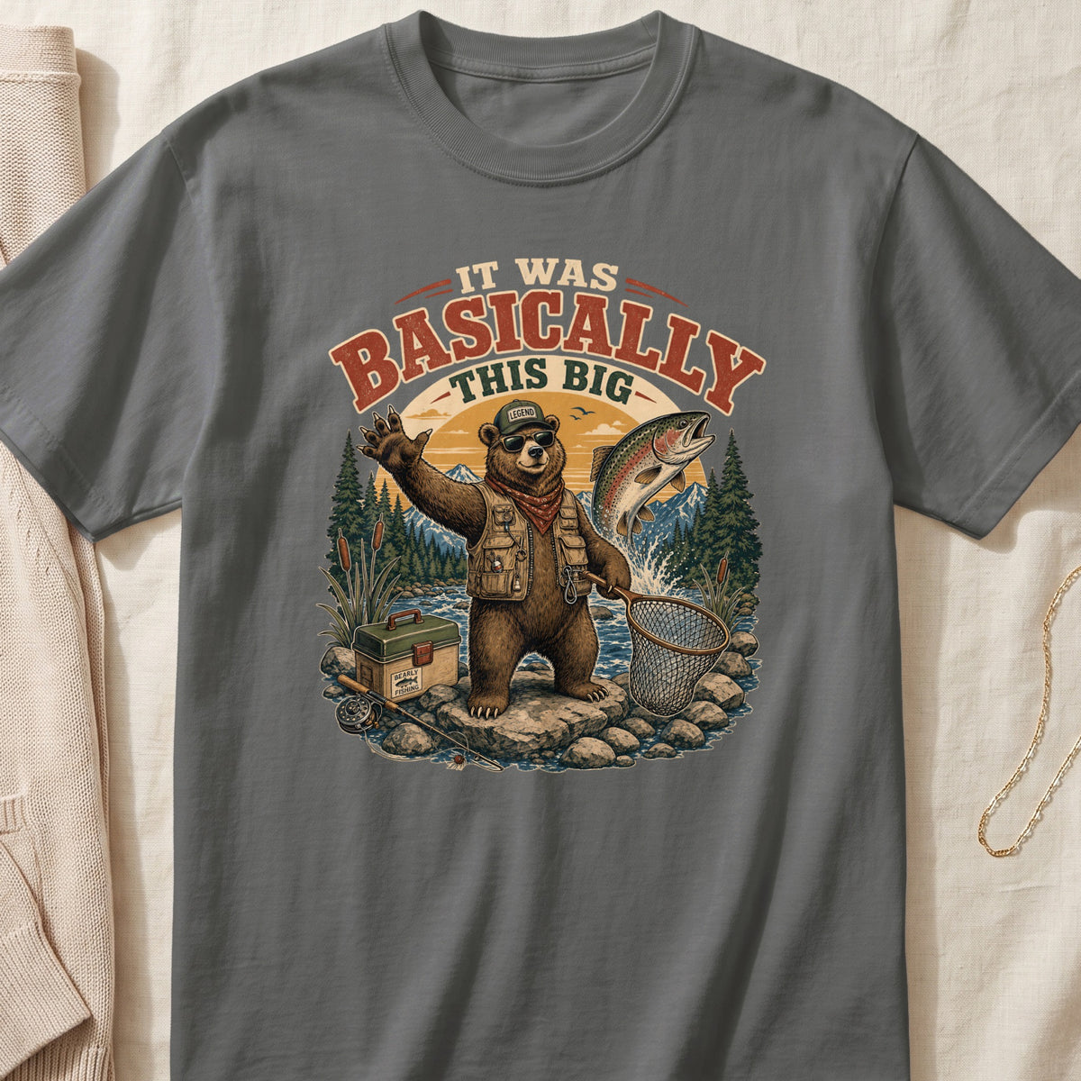 T-shirt graphic of a bear fishing, with text "IT WAS BASICALLY THIS BIG".