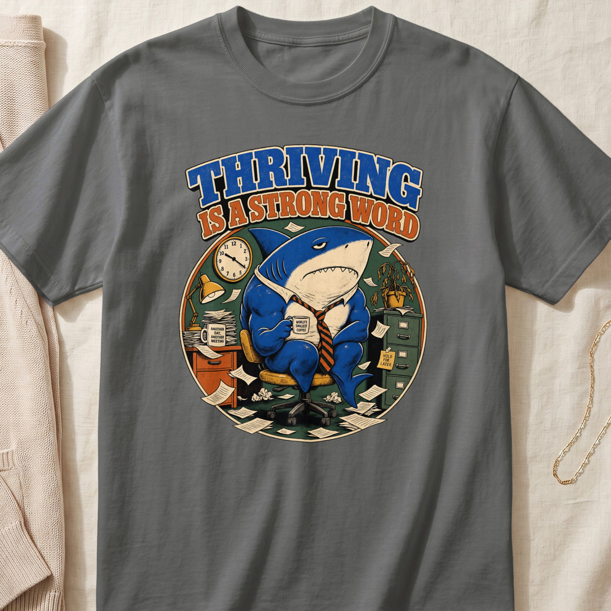 Cartoon shark in office chair with "Thriving is a Strong Word" text.
