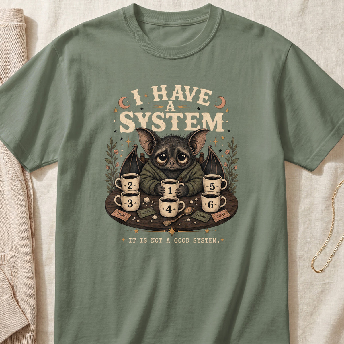 Bat holding coffee cups with numbers 1-6, text "I Have a System".