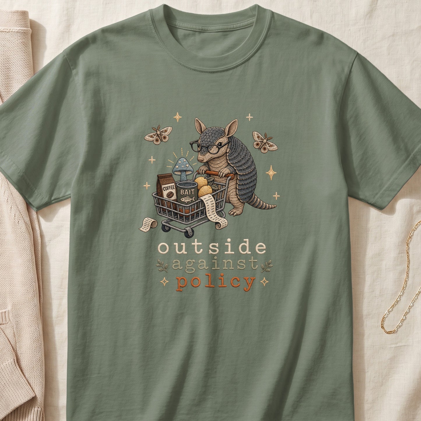 Armadillo with glasses pushes shopping cart with coffee, mushrooms, and bait. Text reads "outside against policy."