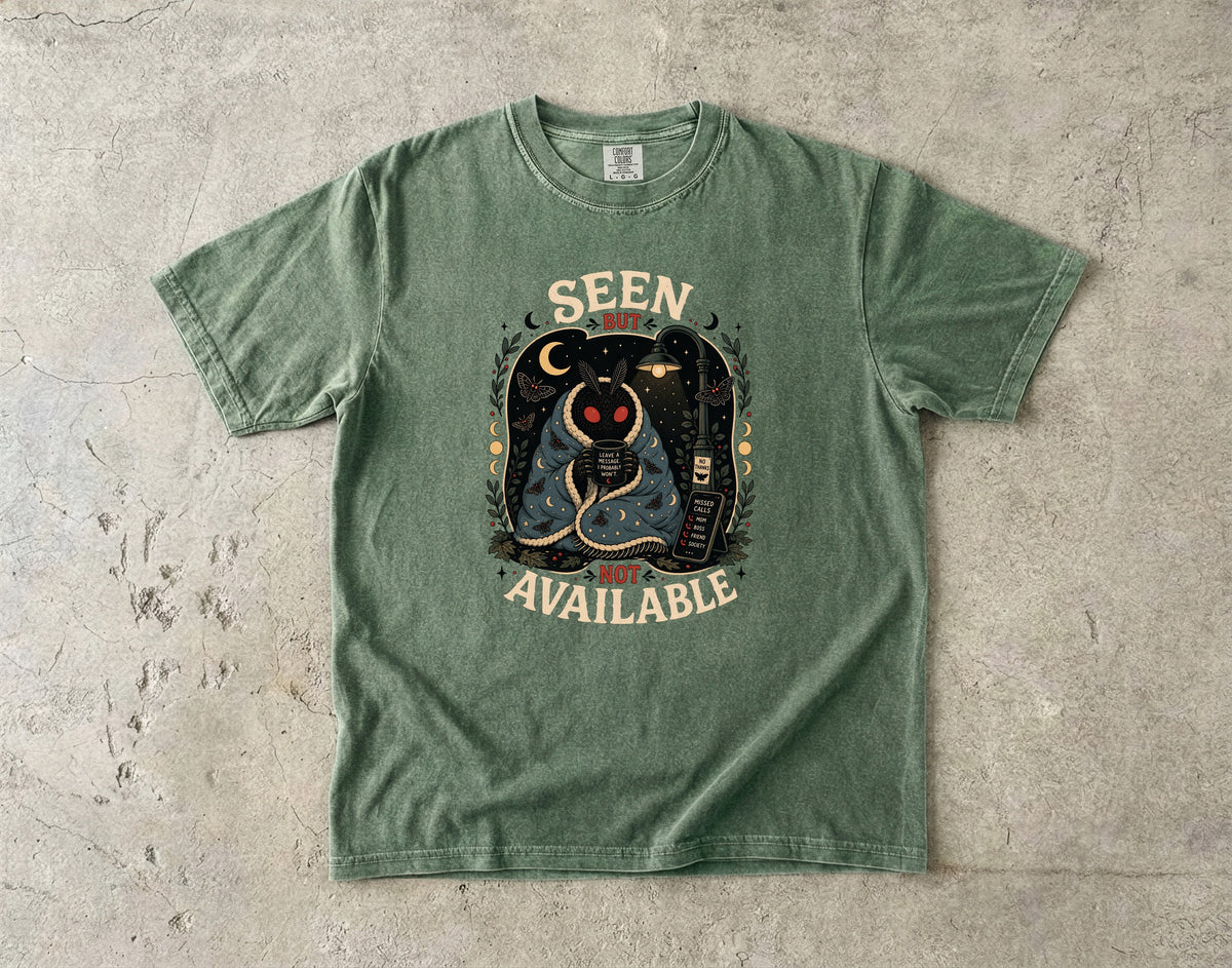 Green t-shirt with "SEEN BUT NOT AVAILABLE" text and moth illustration.