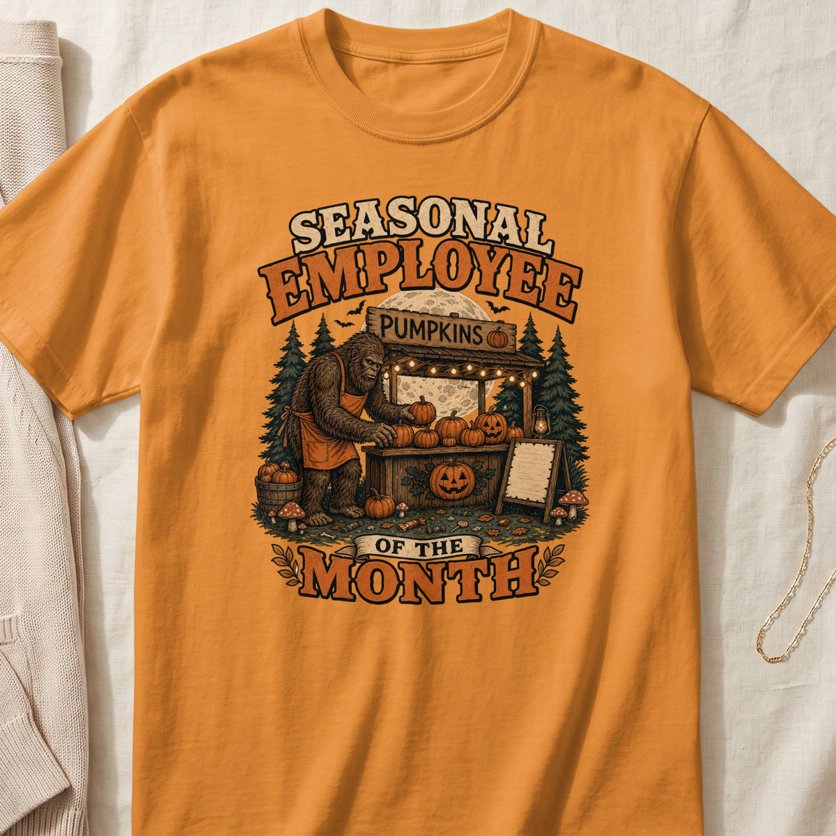 Seasonal employee of the month Bigfoot selling pumpkins at a stand with full moon.