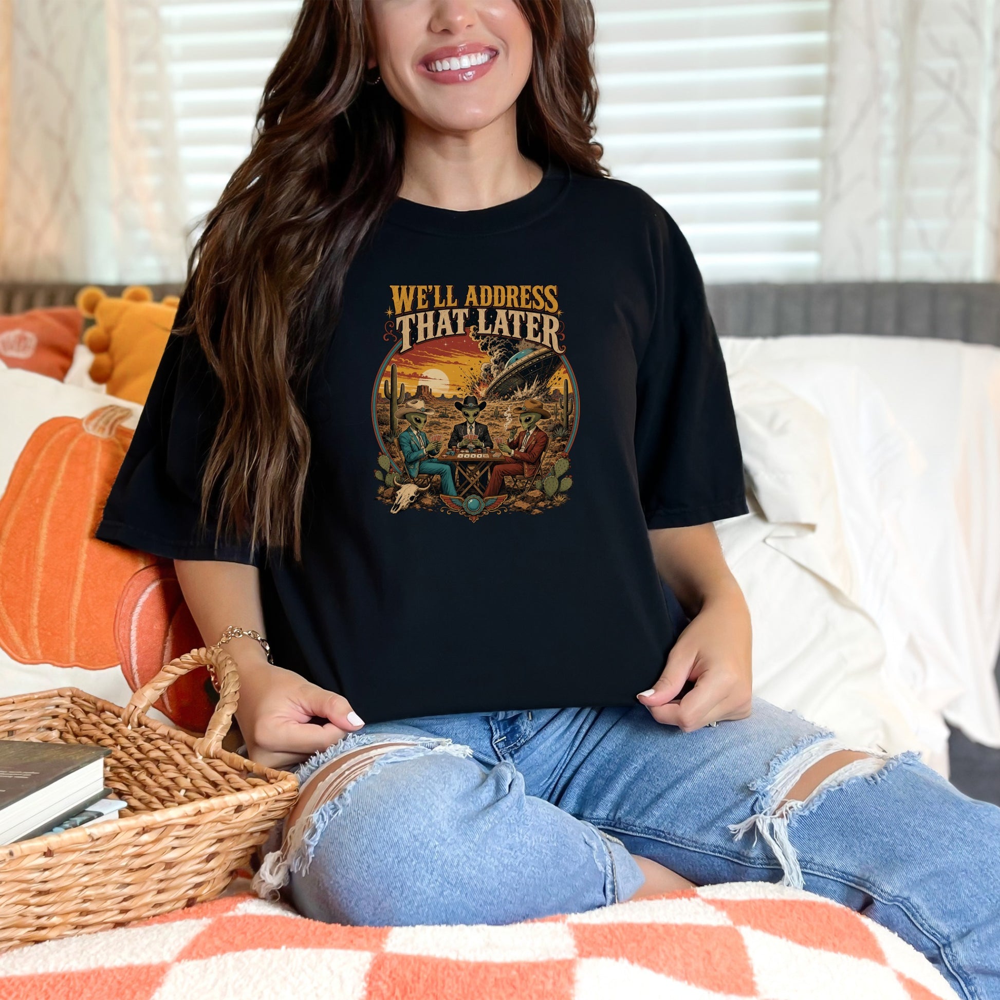 Black t-shirt with text "We'll Address That Later" and desert scene with aliens playing poker.