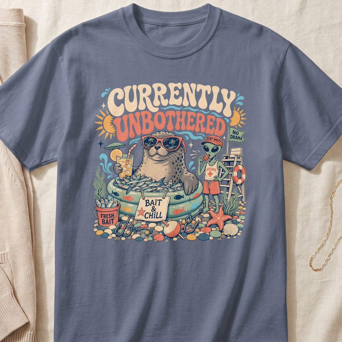 Seal wearing sunglasses in kiddie pool full of fish with text "Currently Unbothered Bait & Chill".