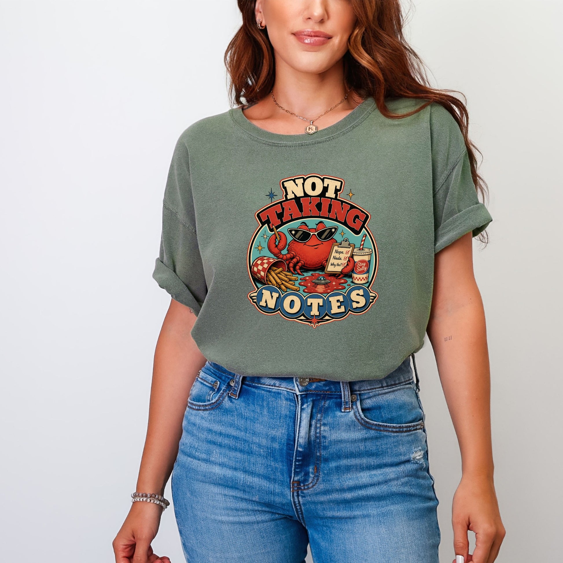 Graphic tee with a crab wearing sunglasses and holding a pen, text says "Not Taking Notes".