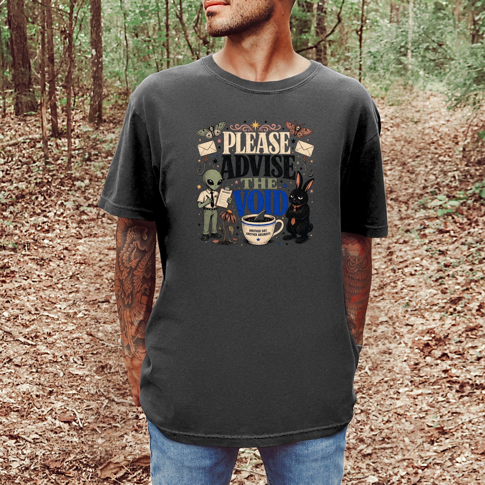 Dark t-shirt with "Please Advise the Void" text and quirky cartoon characters.