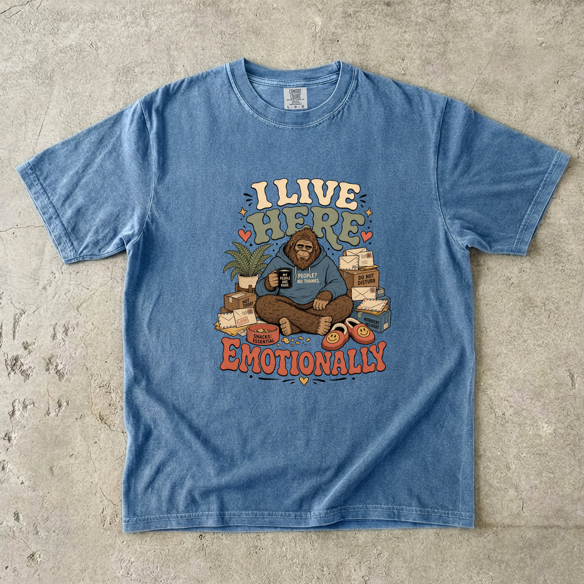 Bigfoot in hoodie reading "I live here emotionally" surrounded by mail.