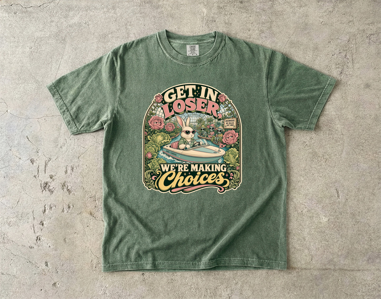 Green t-shirt with rabbit in a boat and aliens saying "Get in loser, we're making choices."
