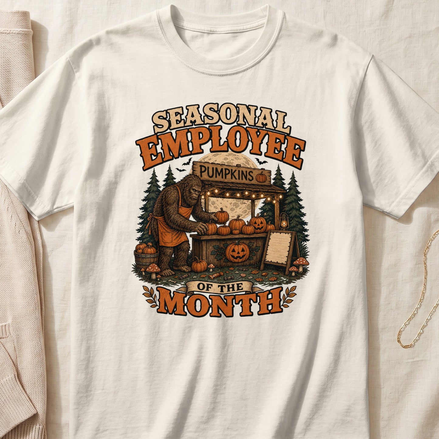 Bigfoot at a pumpkin stand with text "Seasonal Employee of the Month"