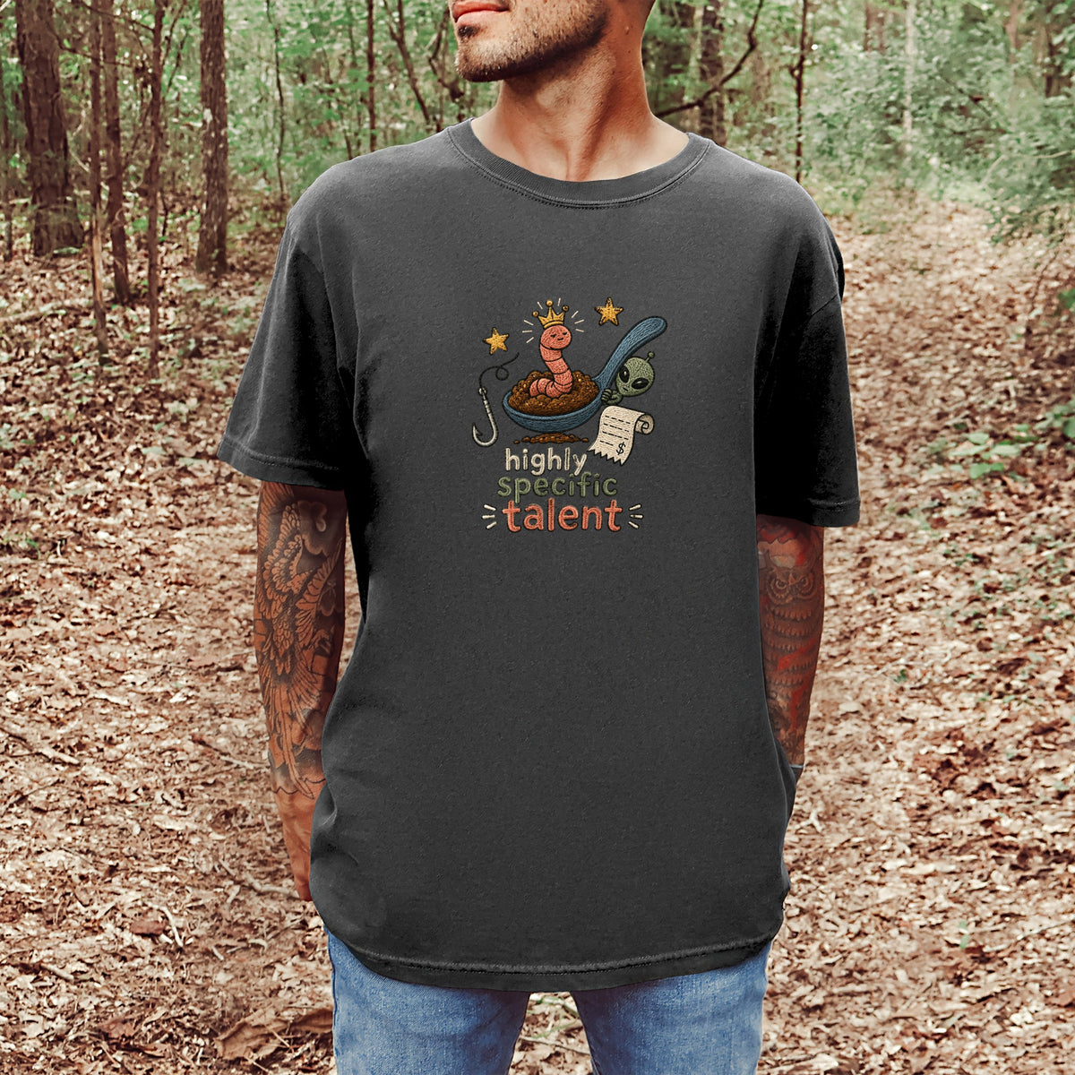 T-shirt with a worm wearing a crown and the words "highly specific talent".