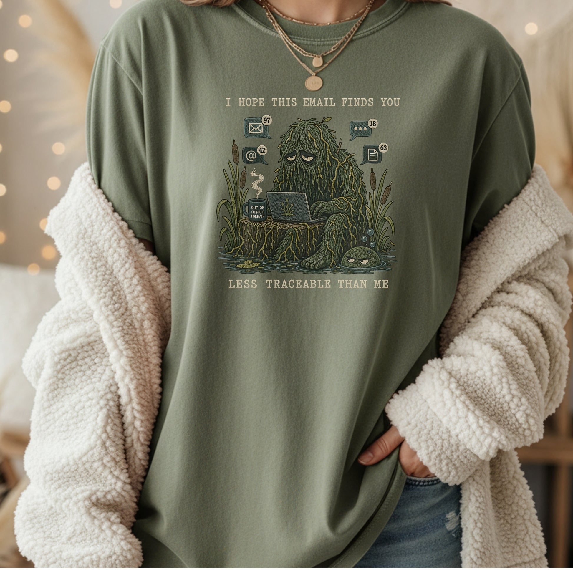 Green t-shirt with "I Hope This Email Finds You Less Traceable Than Me" graphic.