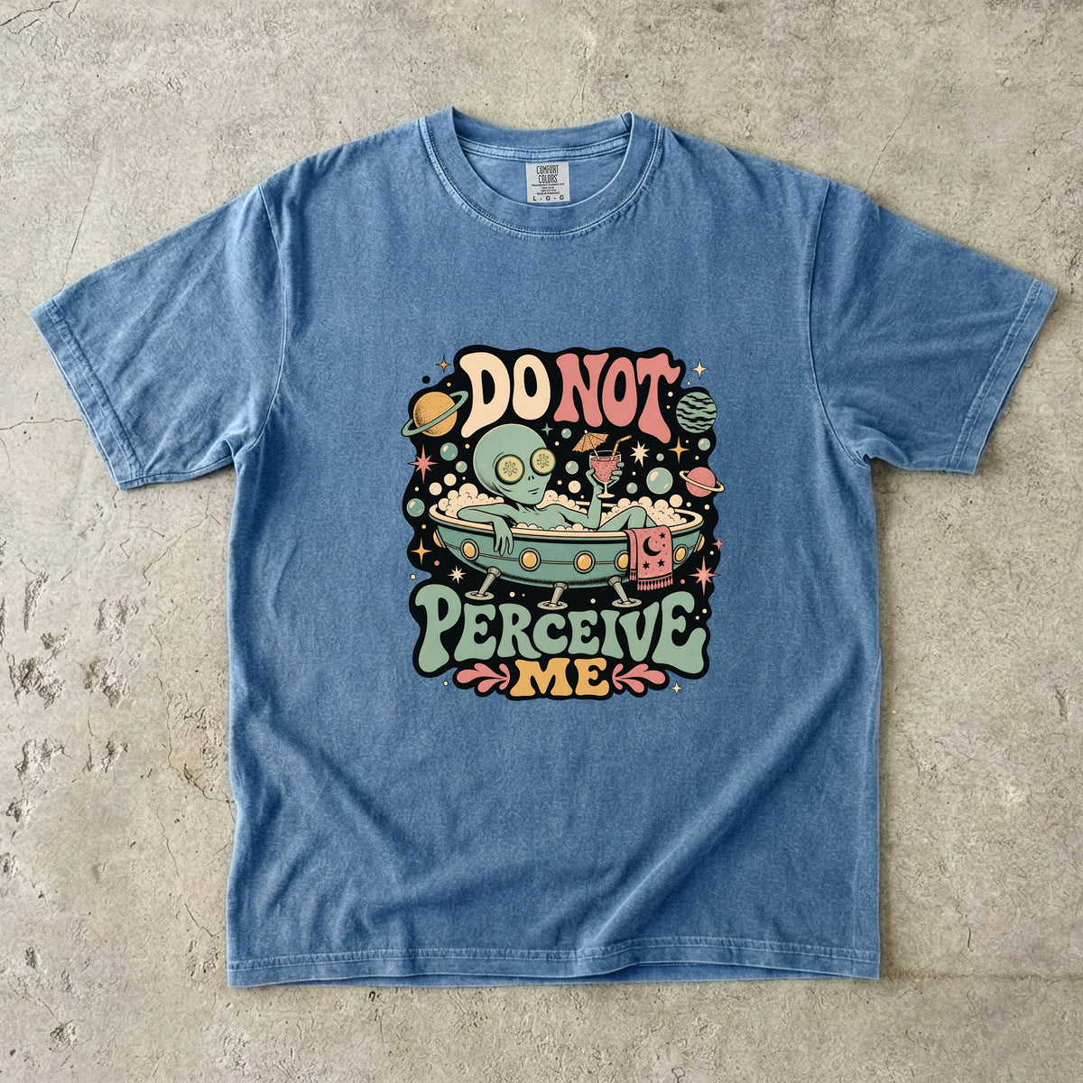 Blue t-shirt with alien in bathtub graphic and text "DO NOT PERCEIVE ME".