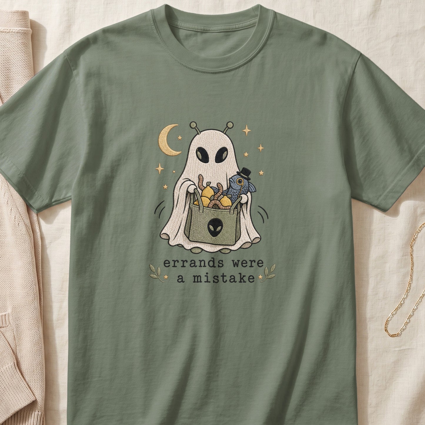 Green t-shirt with ghost graphic holding bag and text "errands were a mistake."
