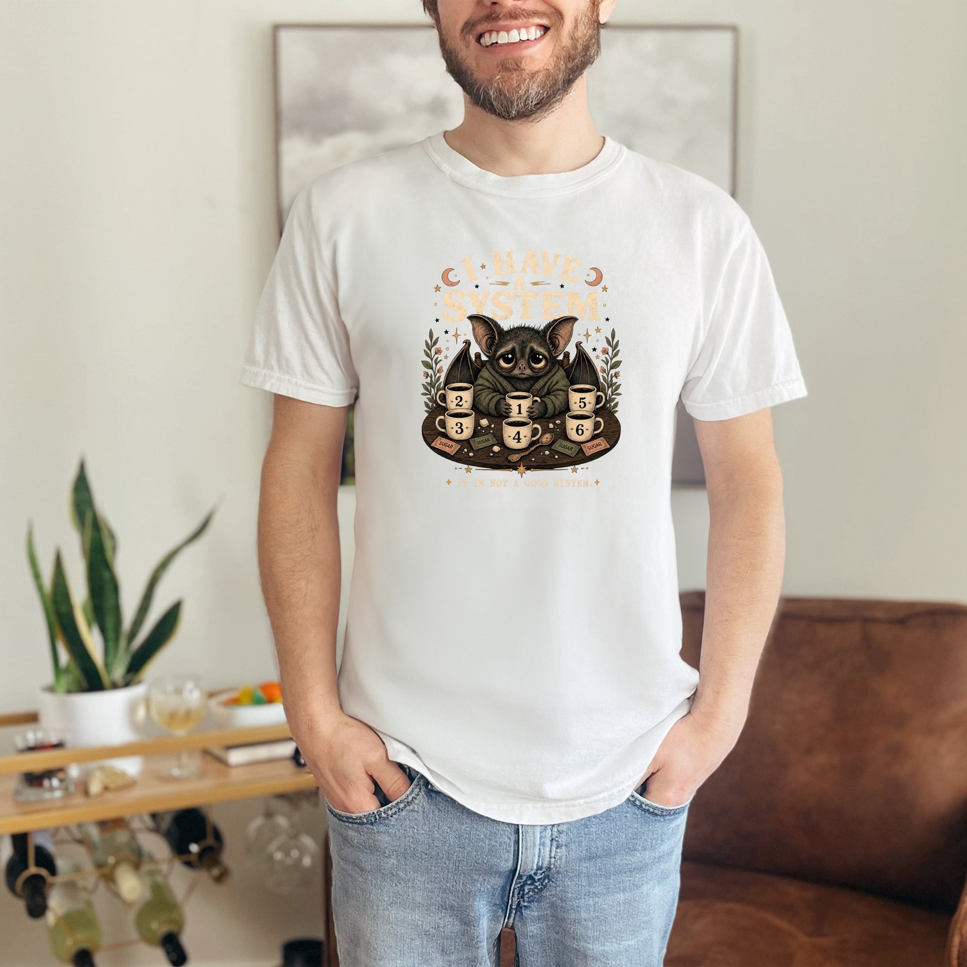 T-shirt graphic of a bat with "I HAVE A SYSTEM" and numbered coffee cups.