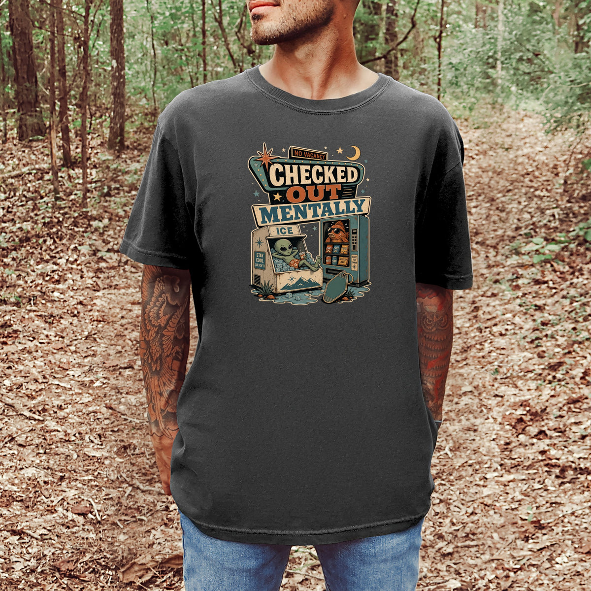 T-shirt graphic with alien in icebox and vending machine, "Checked Out Mentally" text.