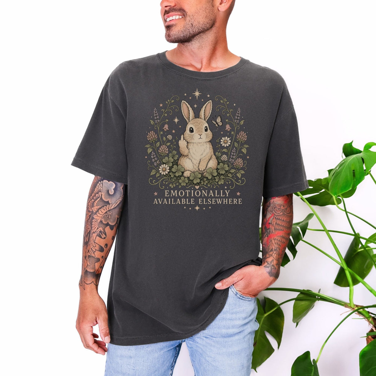 Dark grey t-shirt with a rabbit design and text: Emotionally Available Elsewhere.