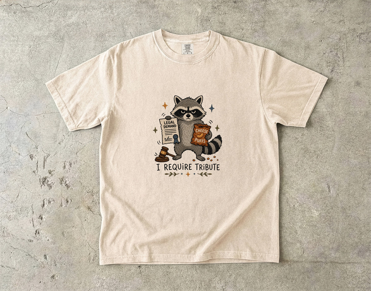 T-shirt with a raccoon holding a "Legal Demand" document and "Cheese Puffs."